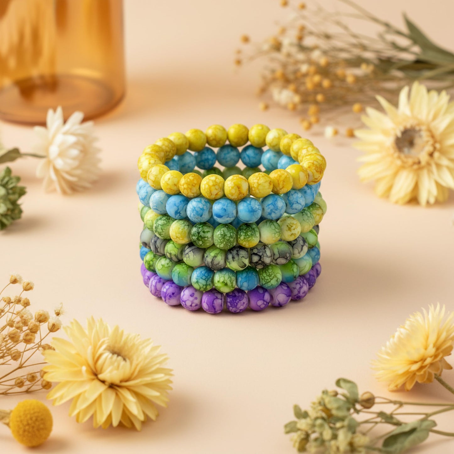 Bring playful color texture to stacked bracelets with multicolor rounded marble-style beads.