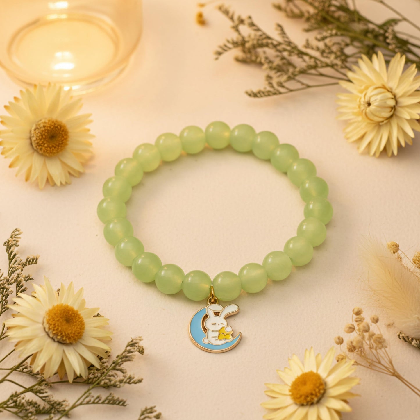 Bring cute charm detail to casual outfits with a green beaded bracelet for girls and women.
