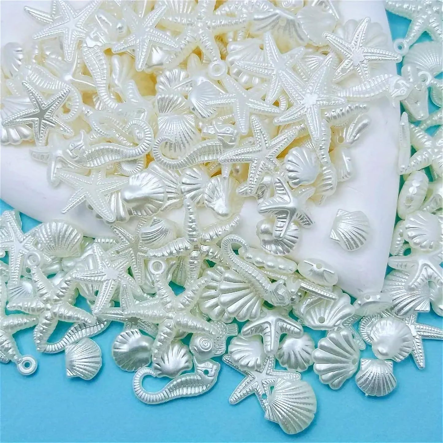 Offwhite Acrylic Beach Charms for DIY Bracelet Making Shell Beads Mix. Detailed product image showing size, surface, and material quality.