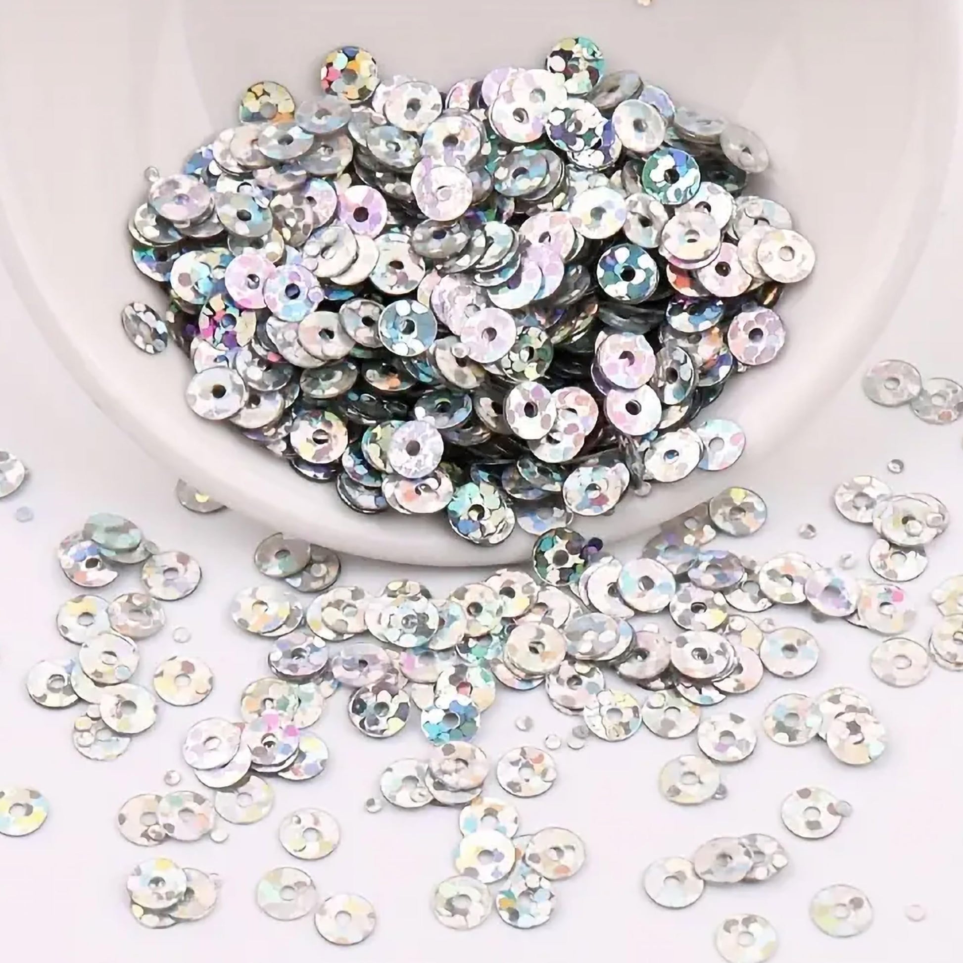Silver 4mm sequins round shape 4mm sitara sequins with holes give Embroidery for embroidery, craft decoration and fabric embellishment a neat visual lift.