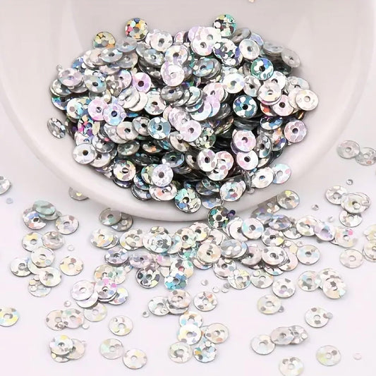 Silver 4mm sequins round shape 4mm sitara sequins with holes give Embroidery for embroidery, craft decoration and fabric embellishment a neat visual lift.