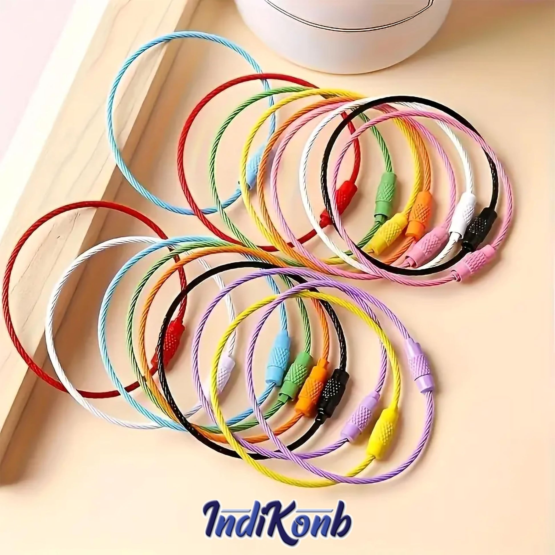 Style tags and zipper pulls with flexible wire cable key rings and a neat craft finish.