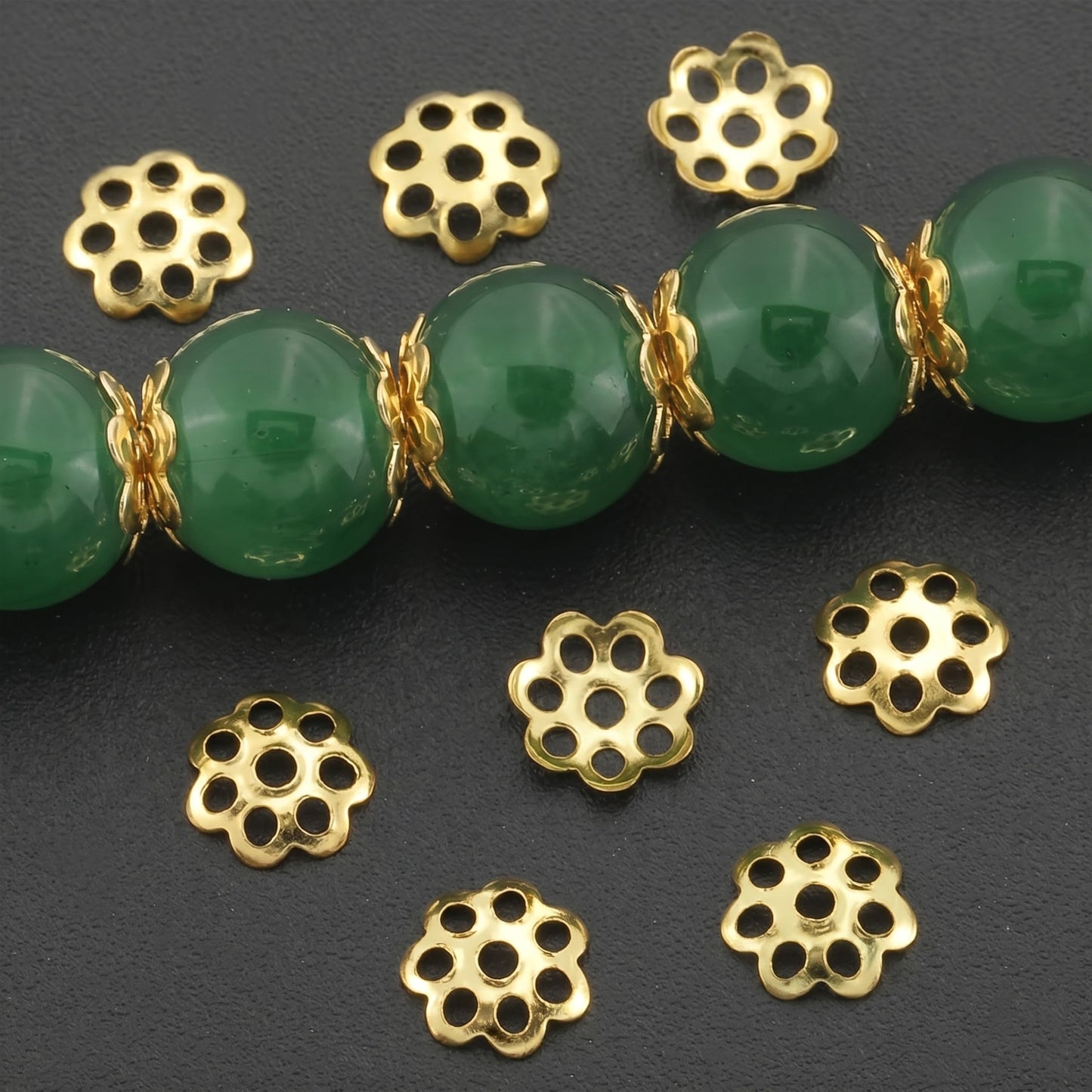 Bring neat finishing detail into bead jewelry with ornate gold jhumka cap findings for saree kuchu craft.