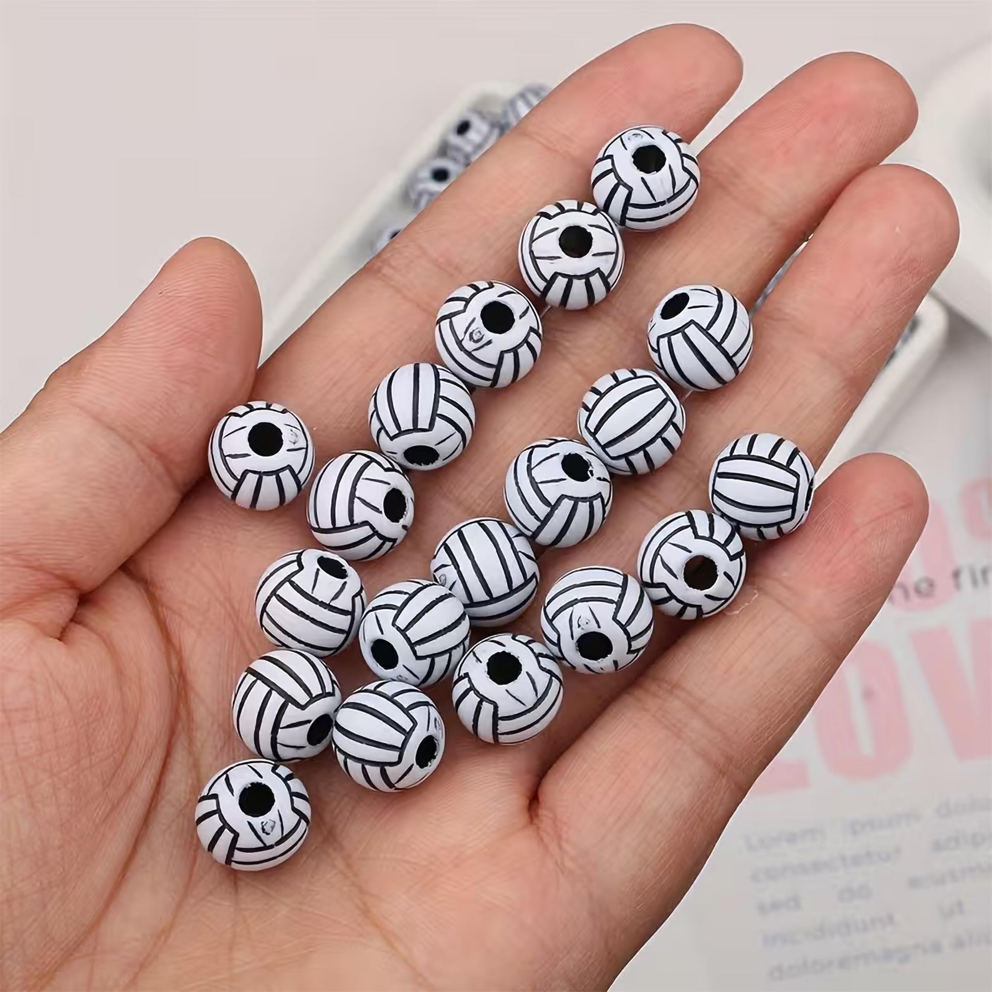 Jewelry making beads with black white volleyball design