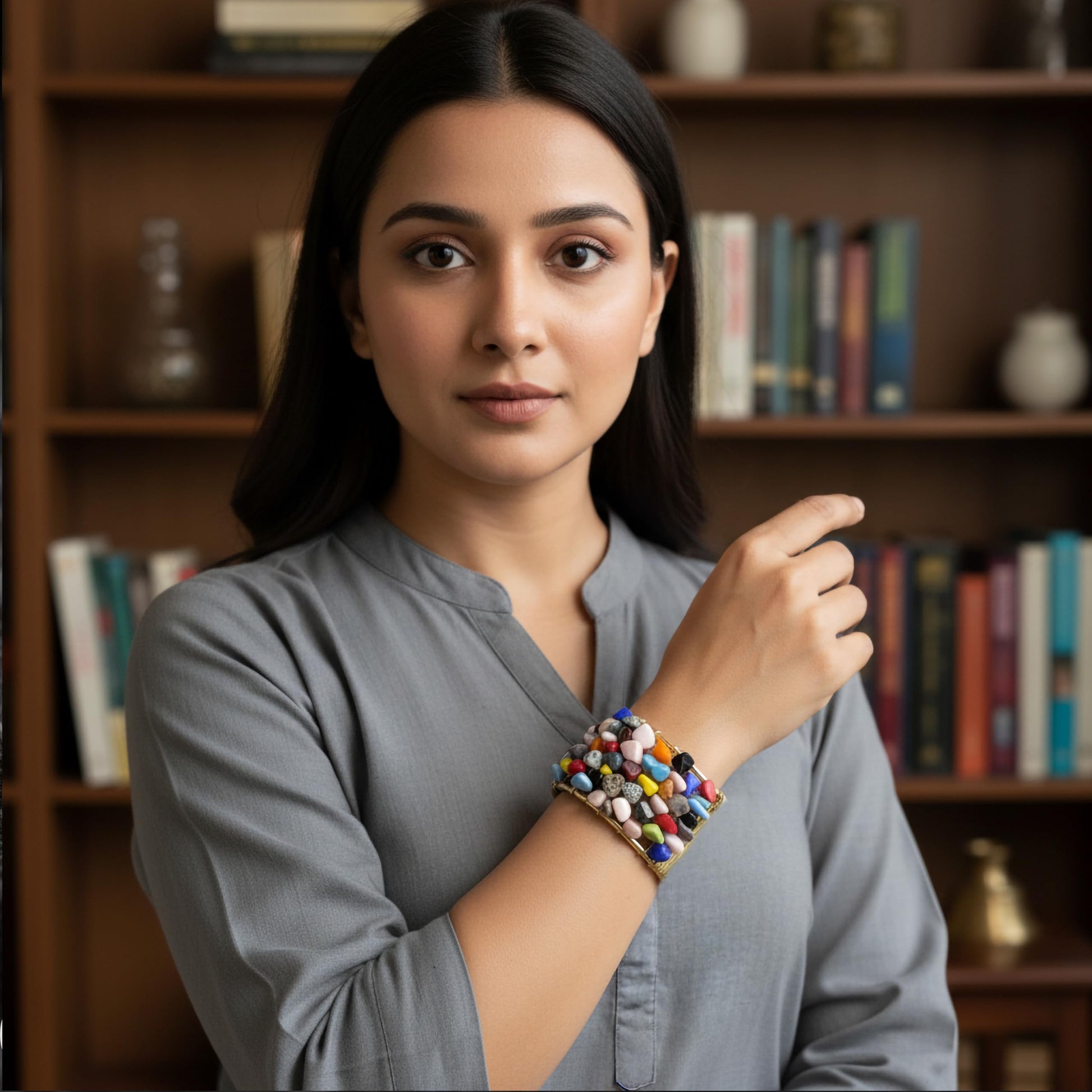 Layer outfits with a textured multicolor stone chip bracelet for a strong modern finish.