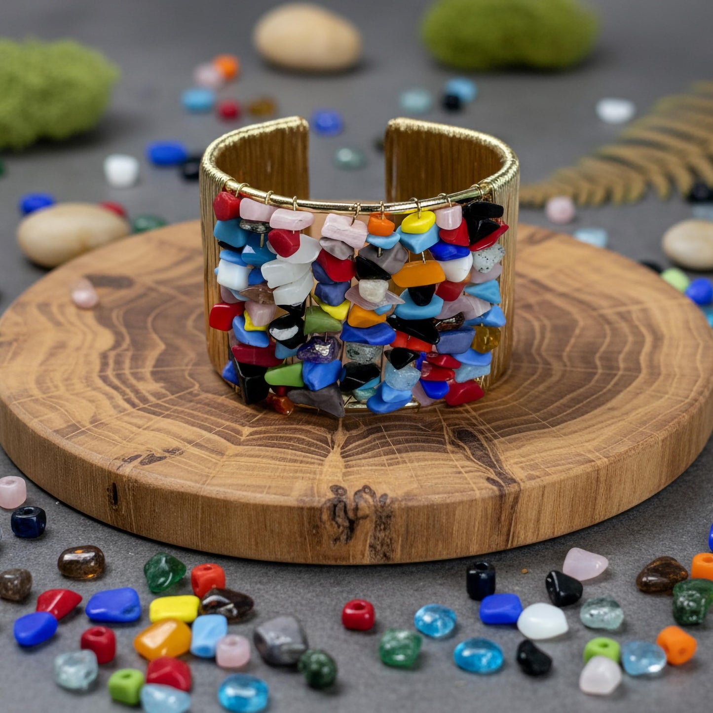 Bring modern jewelry texture to daily looks with multicolor stone chips wrapped in a cuff design.