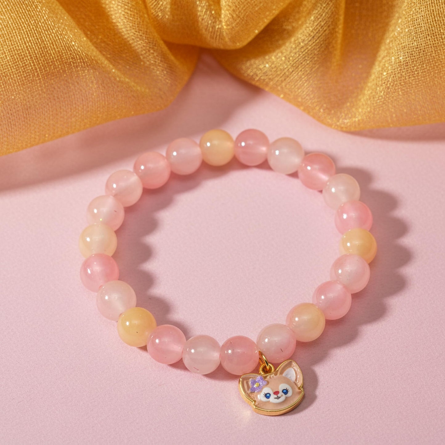 Bring color-block charm to casual outfits with a peach stretch bracelet for girls and women.