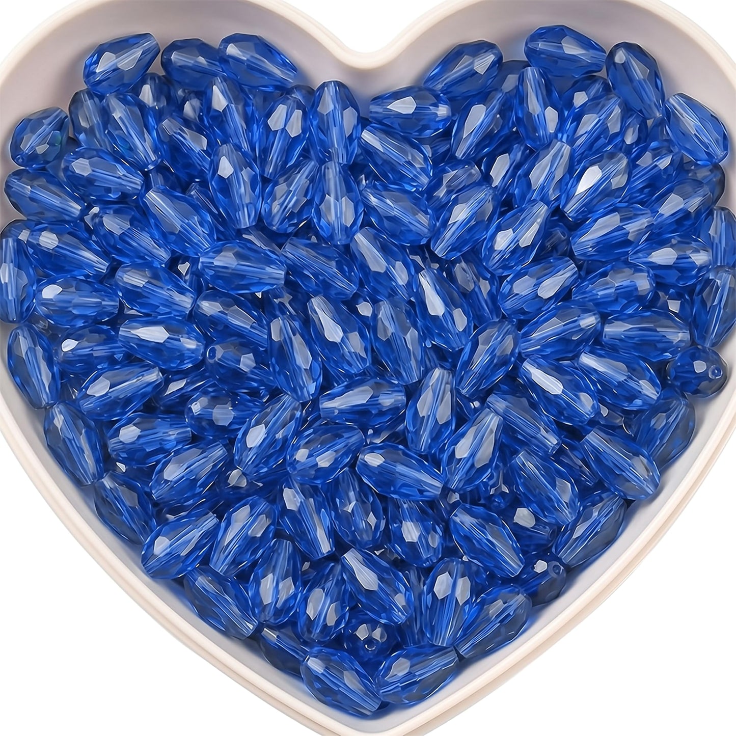 Add graceful dangle accents to earrings and charms with 15x10mm blue faceted teardrop beads.