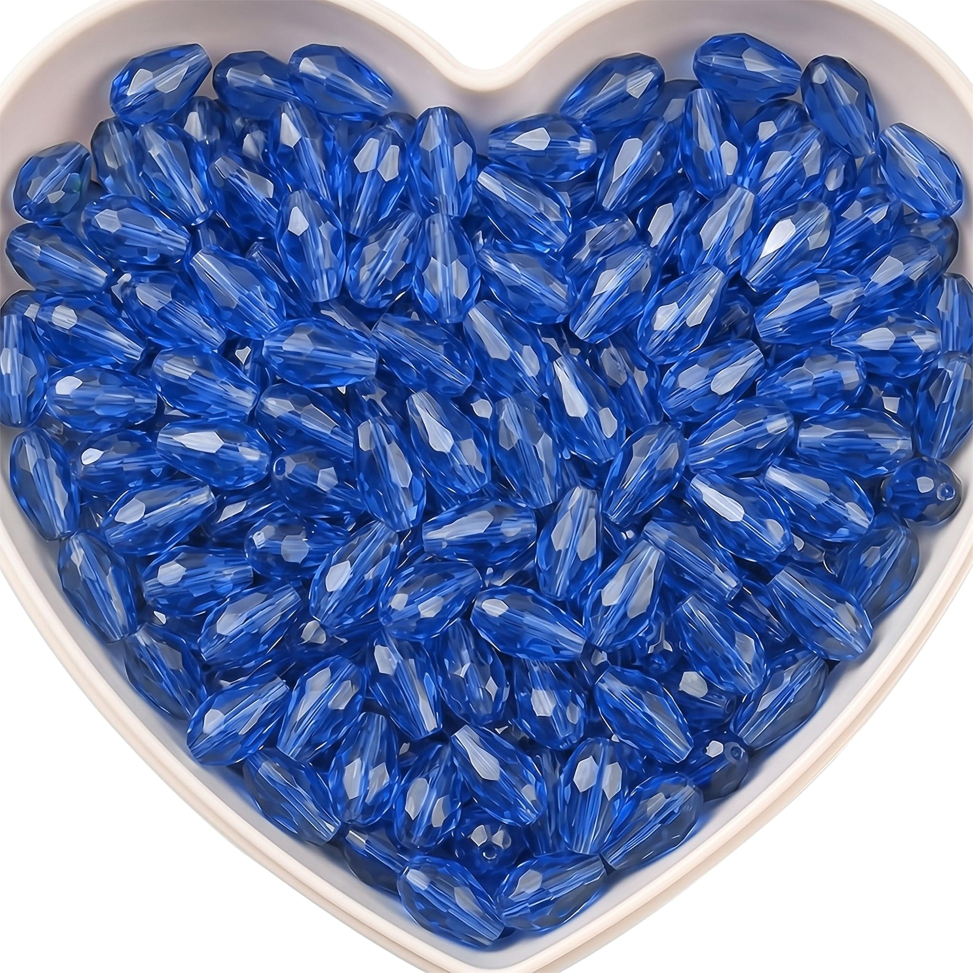 Add graceful dangle accents to earrings and charms with 15x10mm blue faceted teardrop beads.