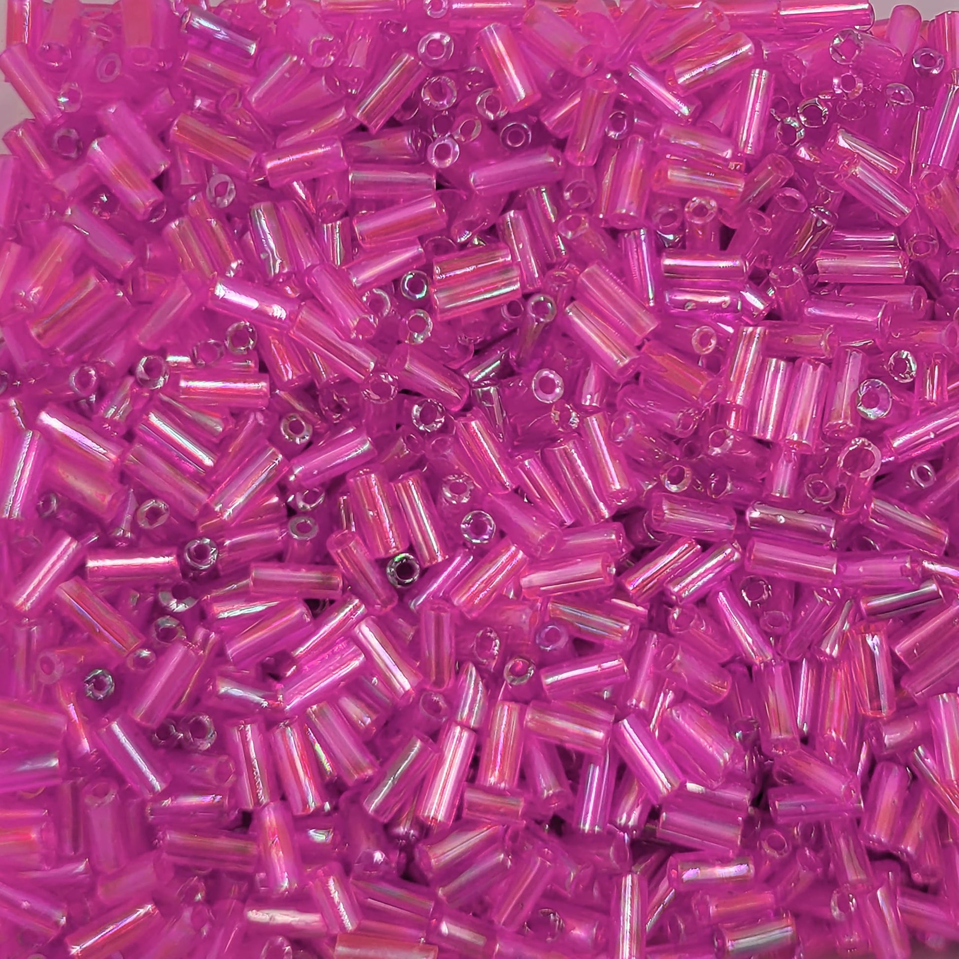 Pink and rainbow 5mm bugle small cut cylinder rainbow tubes 5mm shiny brings a polished accent to DIY craft projects, creative hobby work and decorative handmade designs.