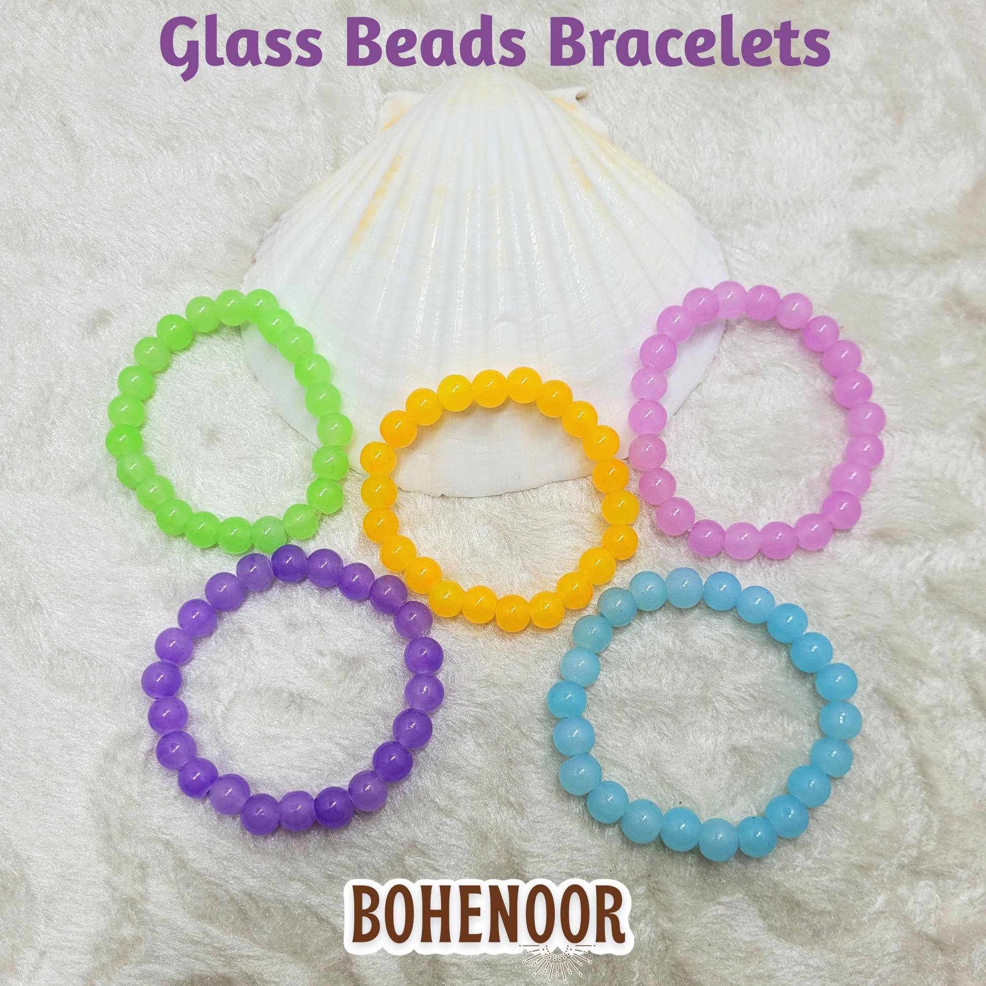 Multicolour glass and elastic bracelet is a clean finishing element for festive outfits.