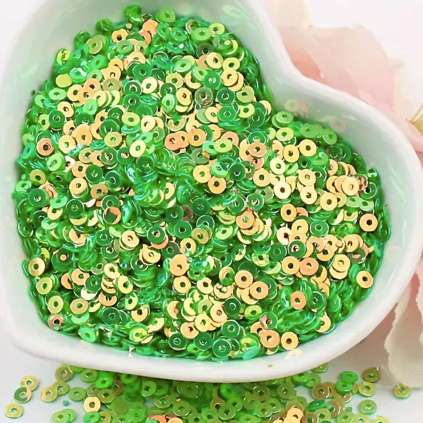 Embroidery for embroidery, craft decoration and fabric embellishment benefits from light green 4mm sequins round shape 4mm sitara sequins with holes and sparkling look.
