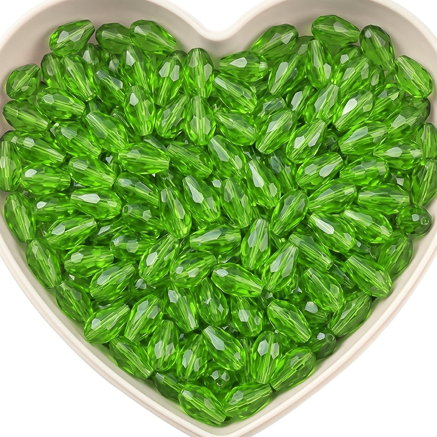 Add graceful dangle accents to earrings and charms with 15x10mm green faceted teardrop beads.