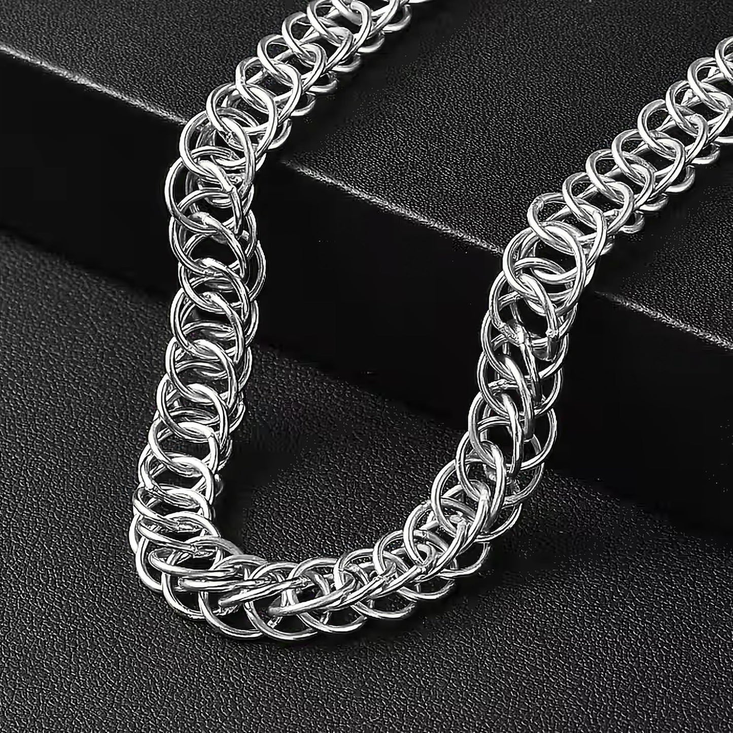 Add clean metal detail to casual outfits and fashion accessories with woven metal chainmaille necklaces.