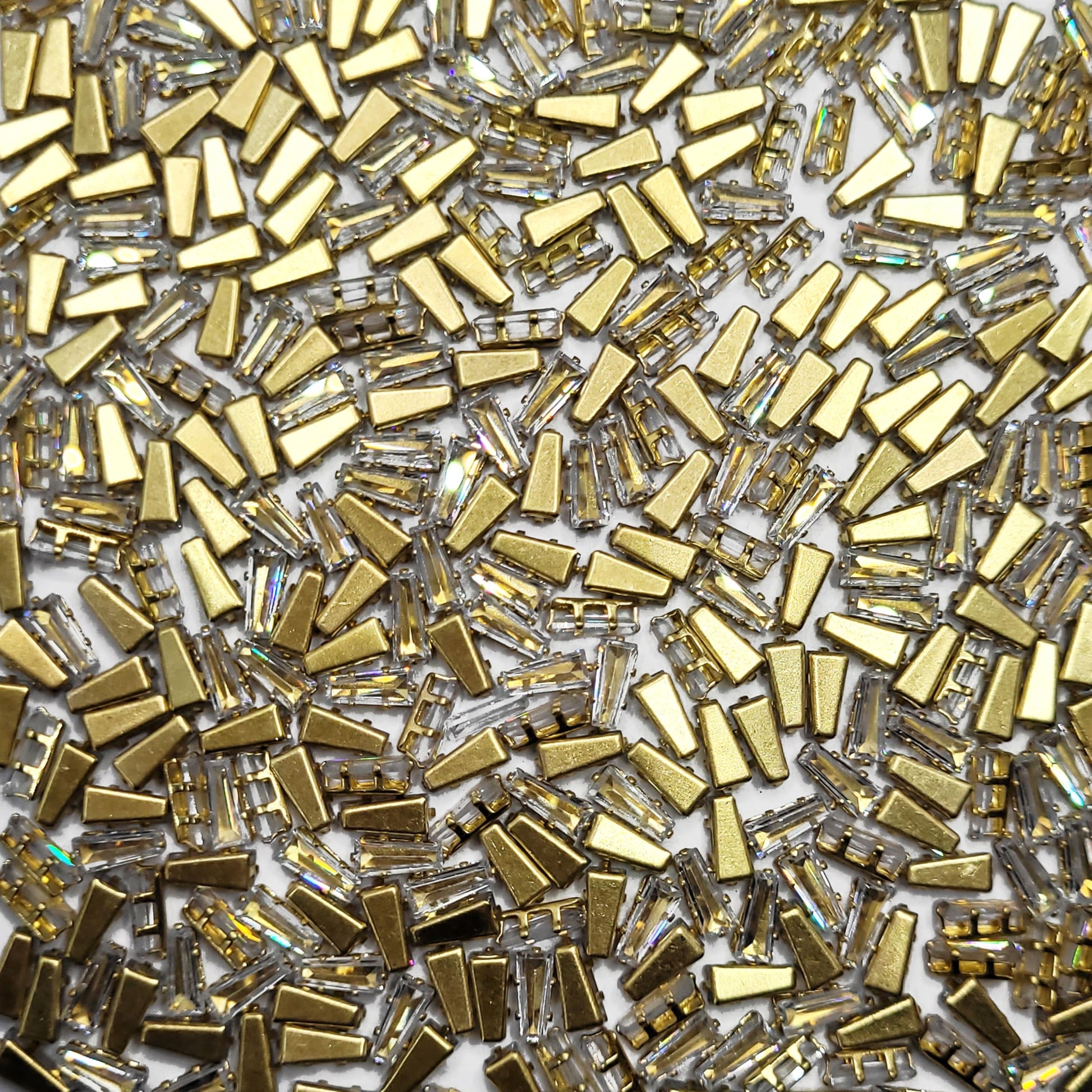 White 2x3x7 and multicolour rhinestone and stone rhinestones and flatback stones bring a polished accent to embellishment work, Lippan art and fabric decoration.