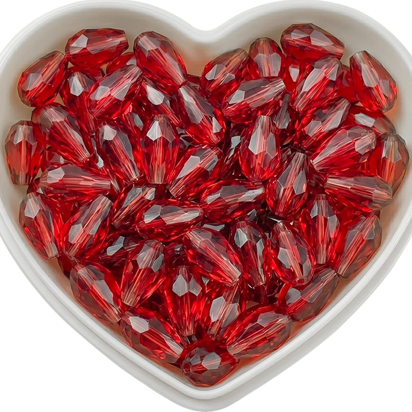Add graceful dangle accents to earrings and charms with 10x6mm red faceted teardrop beads.