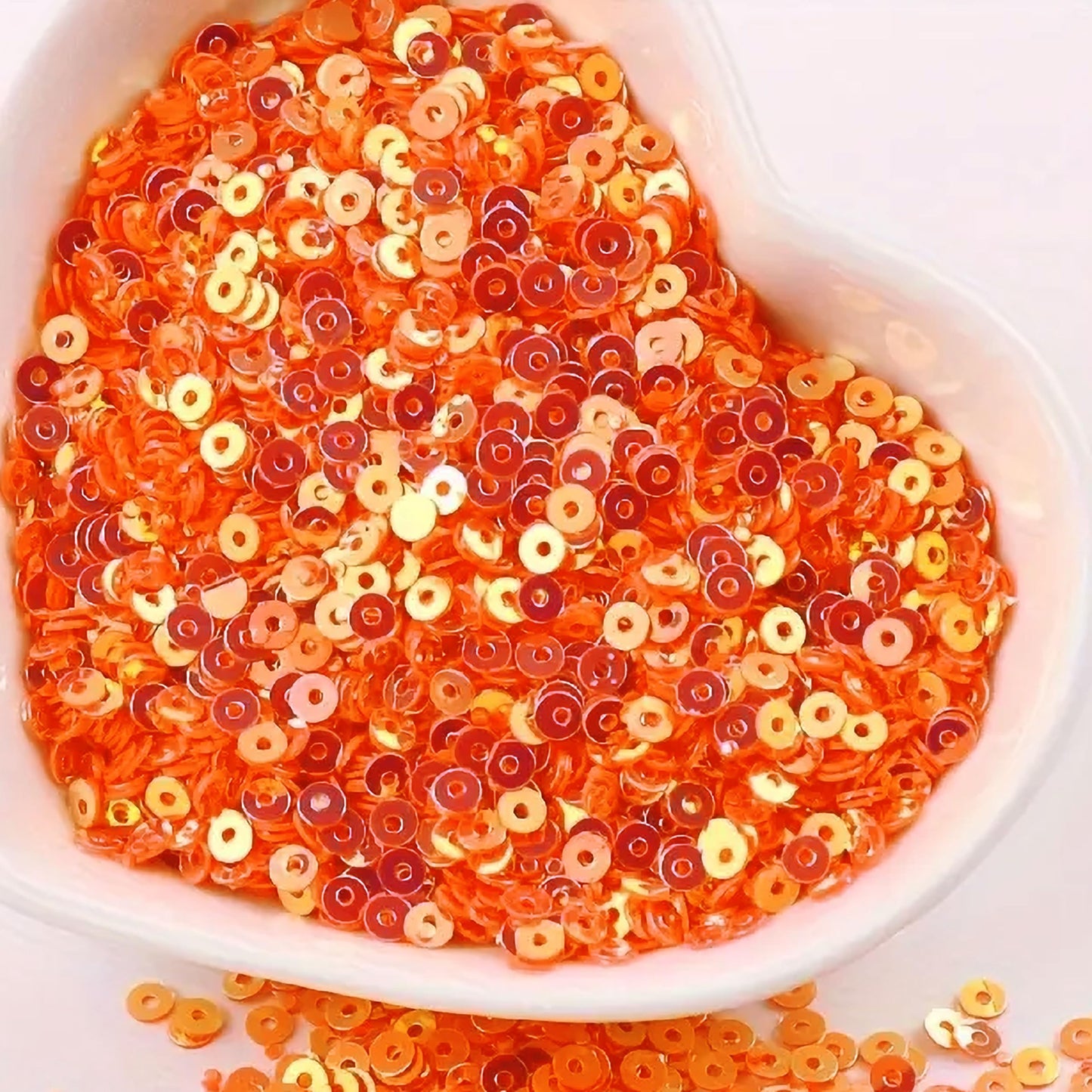 For neat results in Embroidery for embroidery, craft decoration and fabric embellishment, orange 4mm sequins round shape 4mm sitara sequins with holes are a useful detail.