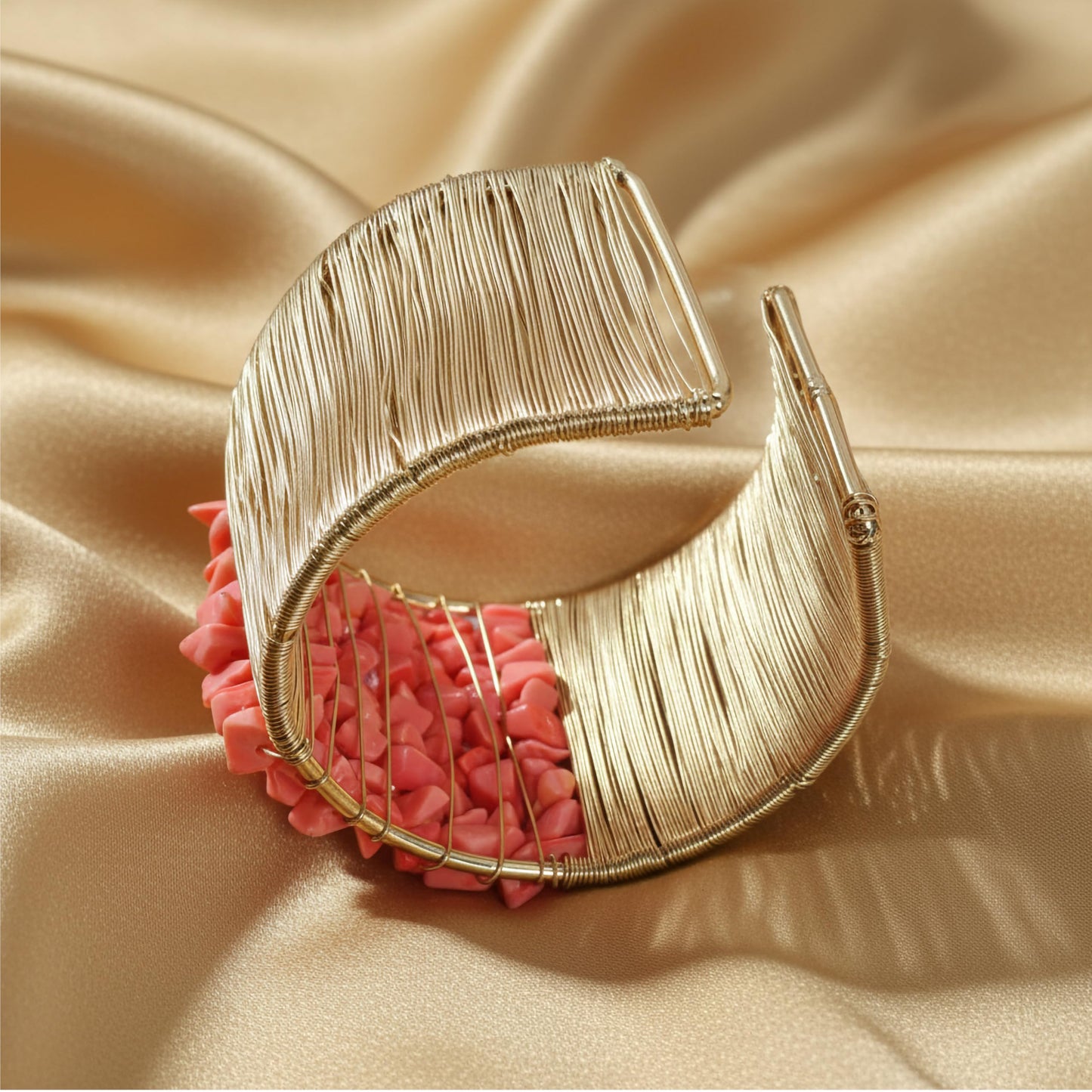 Give casual accessories a polished edge with a pink open cuff bracelet and stone detail.