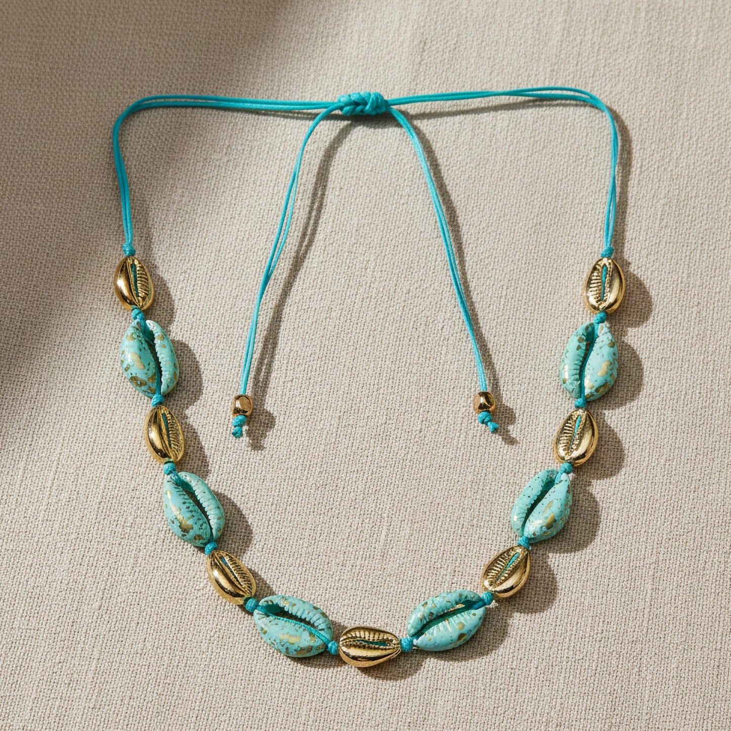 Handmade beach bracelet with turquoise shells and gold accents