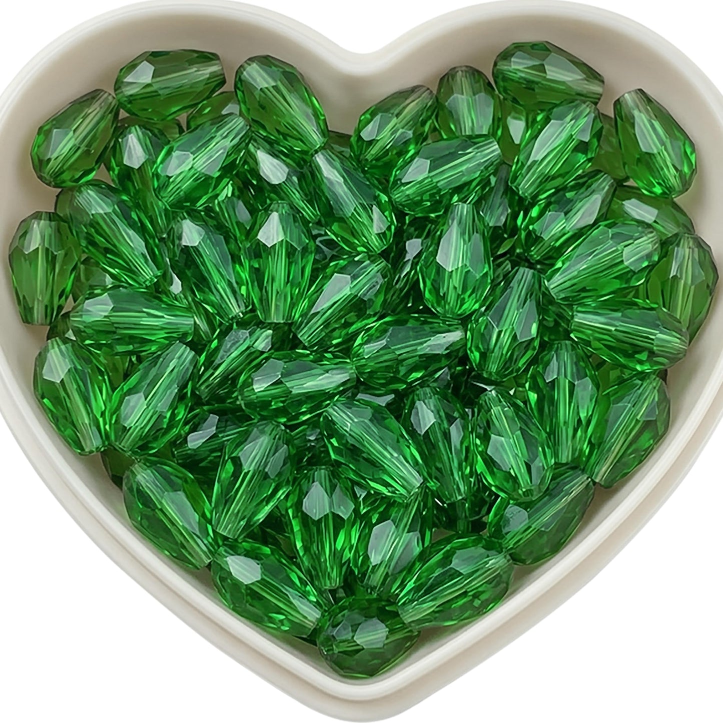 Add graceful dangle accents to earrings and charms with 10x6mm dark green faceted teardrop beads.