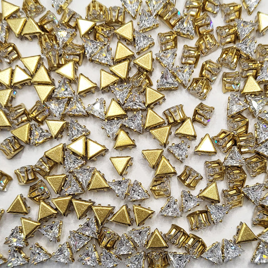 Triangle 5x5x5 and gold rhinestone and stone rhinestones and flatback stones offer a sparkling look for embellishment work, Lippan art and fabric decoration.