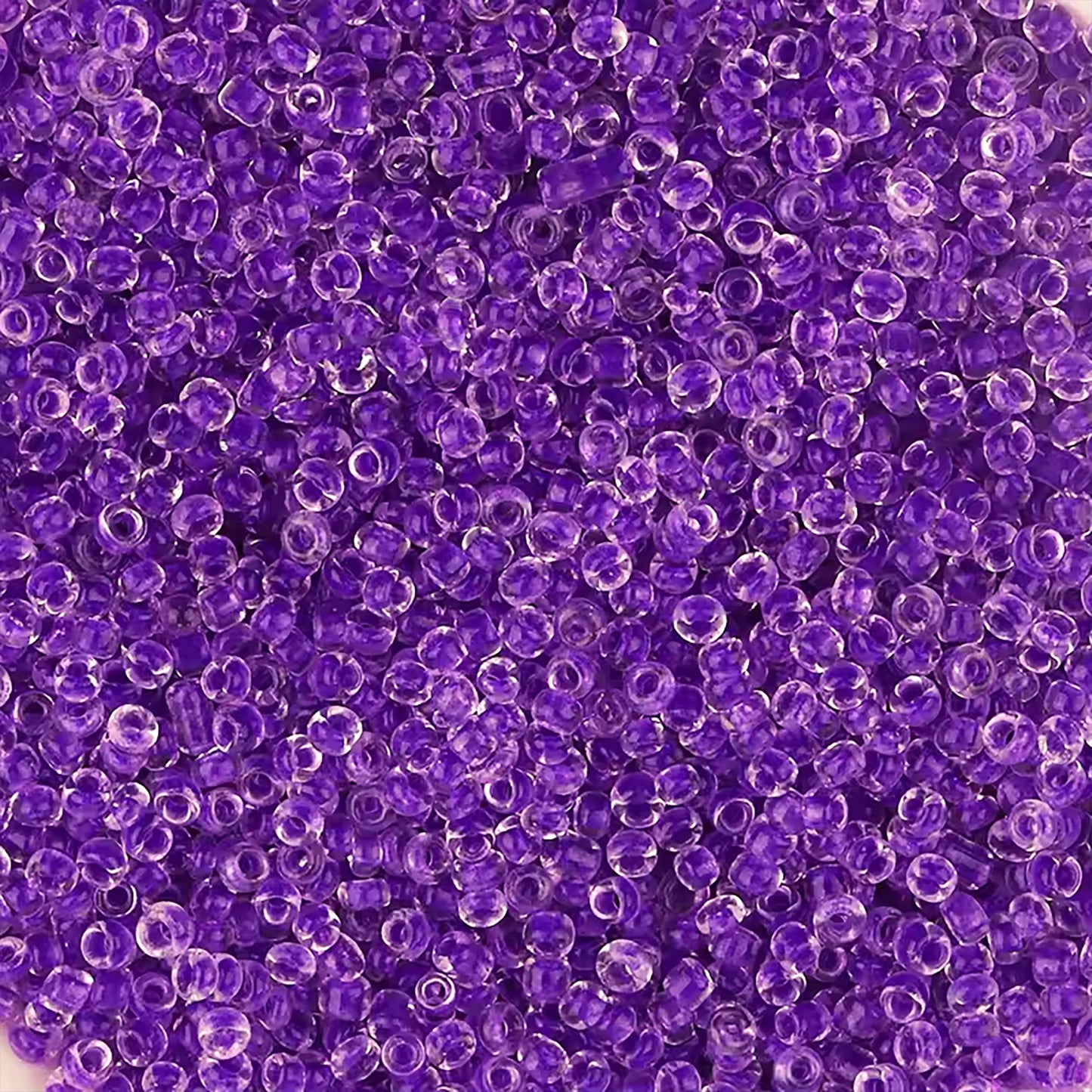 Voilet Seed Beads Transparent Finish Small Glass Beads Size 110-2mm. Main product image showing the full assortment for jewelry making and craft work.