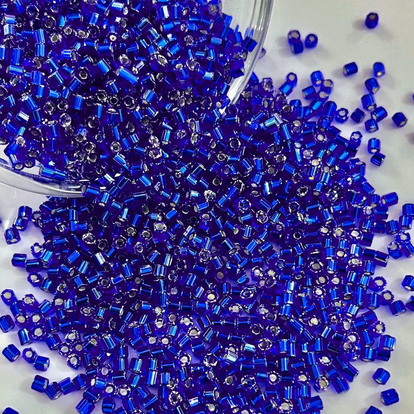 DIY craft projects, creative hobby work and decorative handmade designs can be finished with blue and silver 2.5mm small cut cylinder silverline tubes 2.5mm shiny for clean.