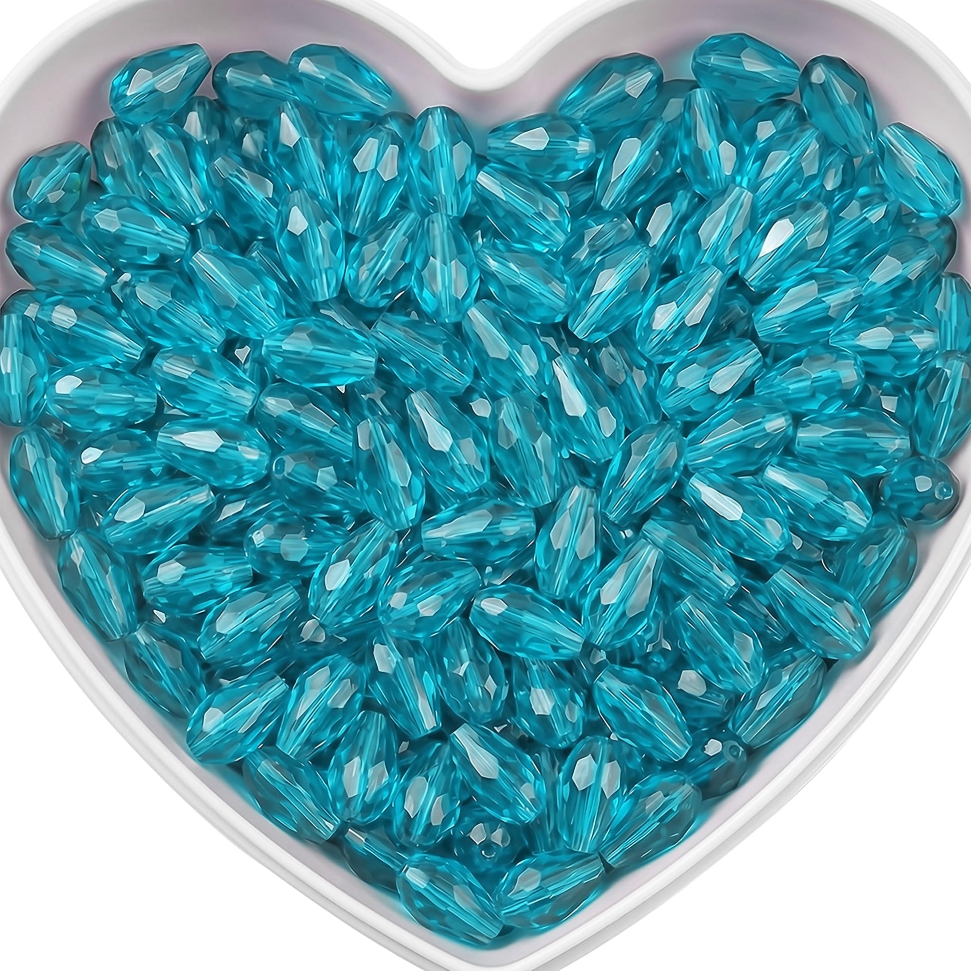 Add graceful dangle accents to earrings and charms with 15x10mm cyan faceted teardrop beads.