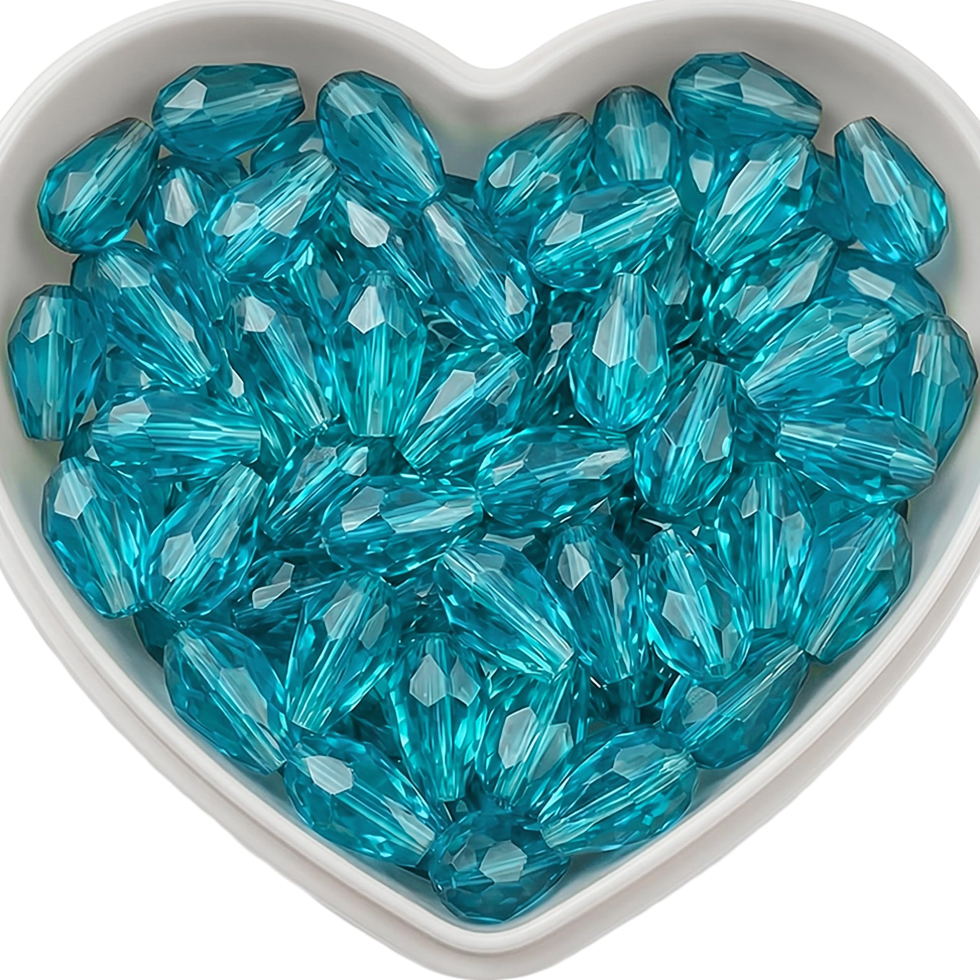 Add graceful dangle accents to earrings and charms with 10x6mm cyan faceted teardrop beads.