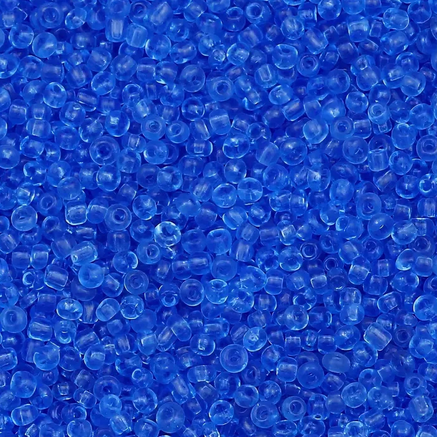Blue and transparent 2mm beads fit into bracelet making, necklace making and DIY jewellery projects without making the design feel heavy.