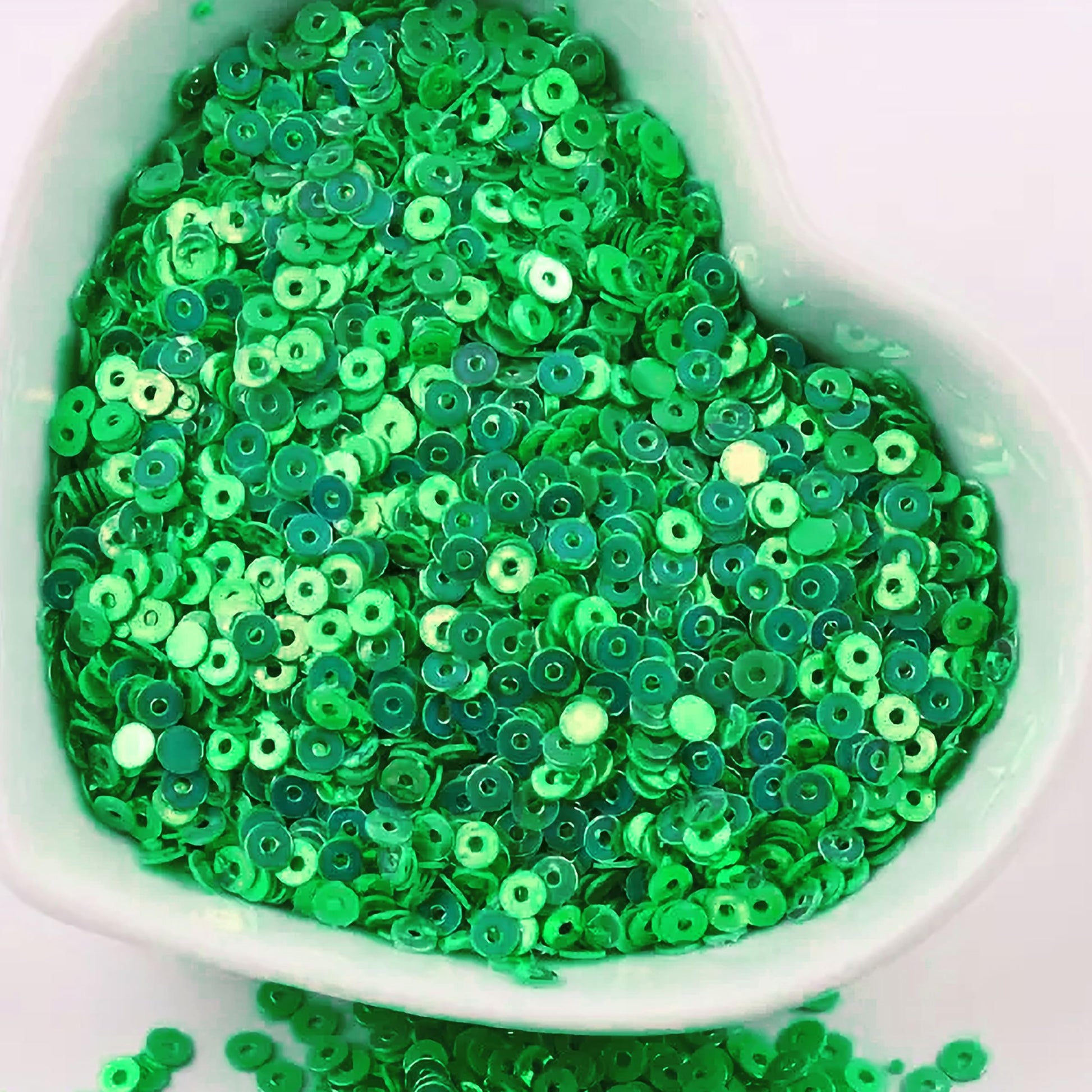 Green 4mm sequins round shape 4mm sitara sequins with holes are useful for detailed work in Embroidery for embroidery, craft decoration and fabric embellishment.