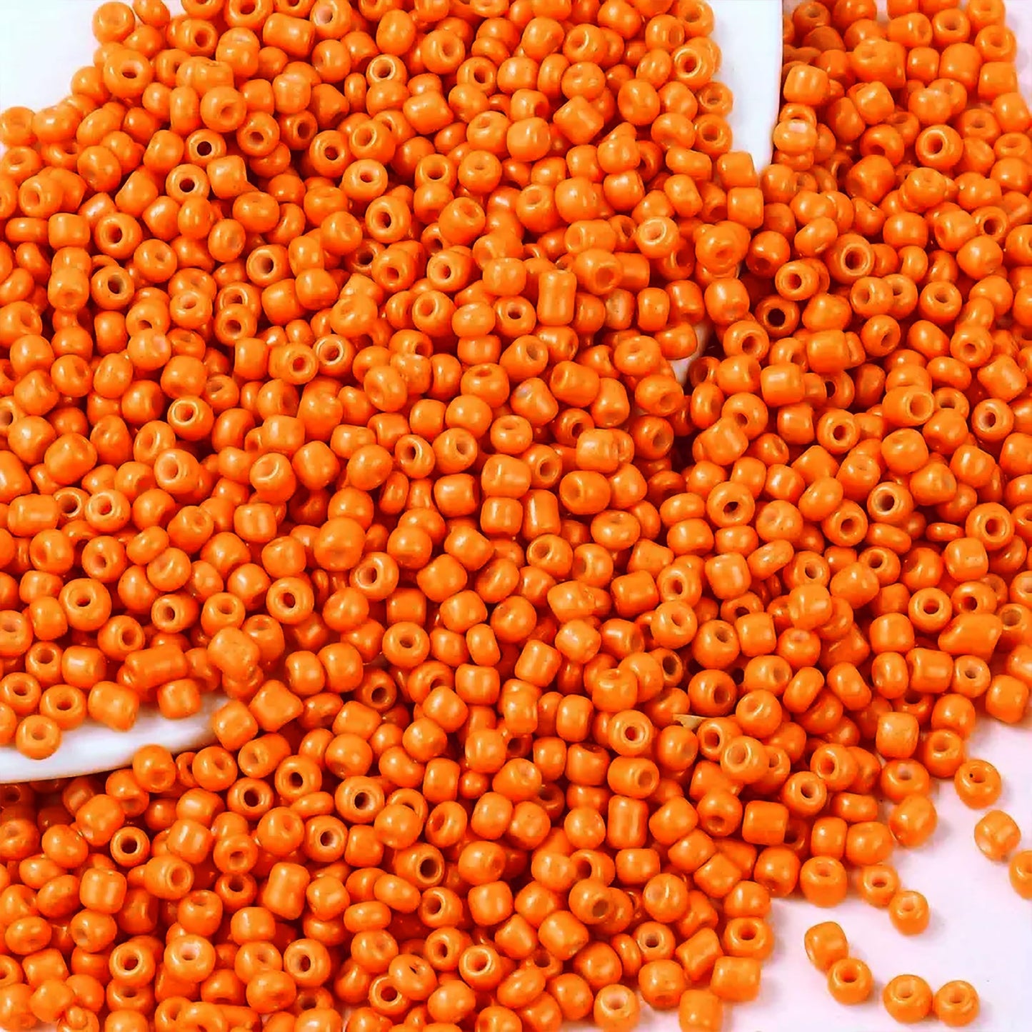 Orange 2mm and 02mm beads are useful for detailed work in bracelet making, necklace making and DIY jewellery projects.