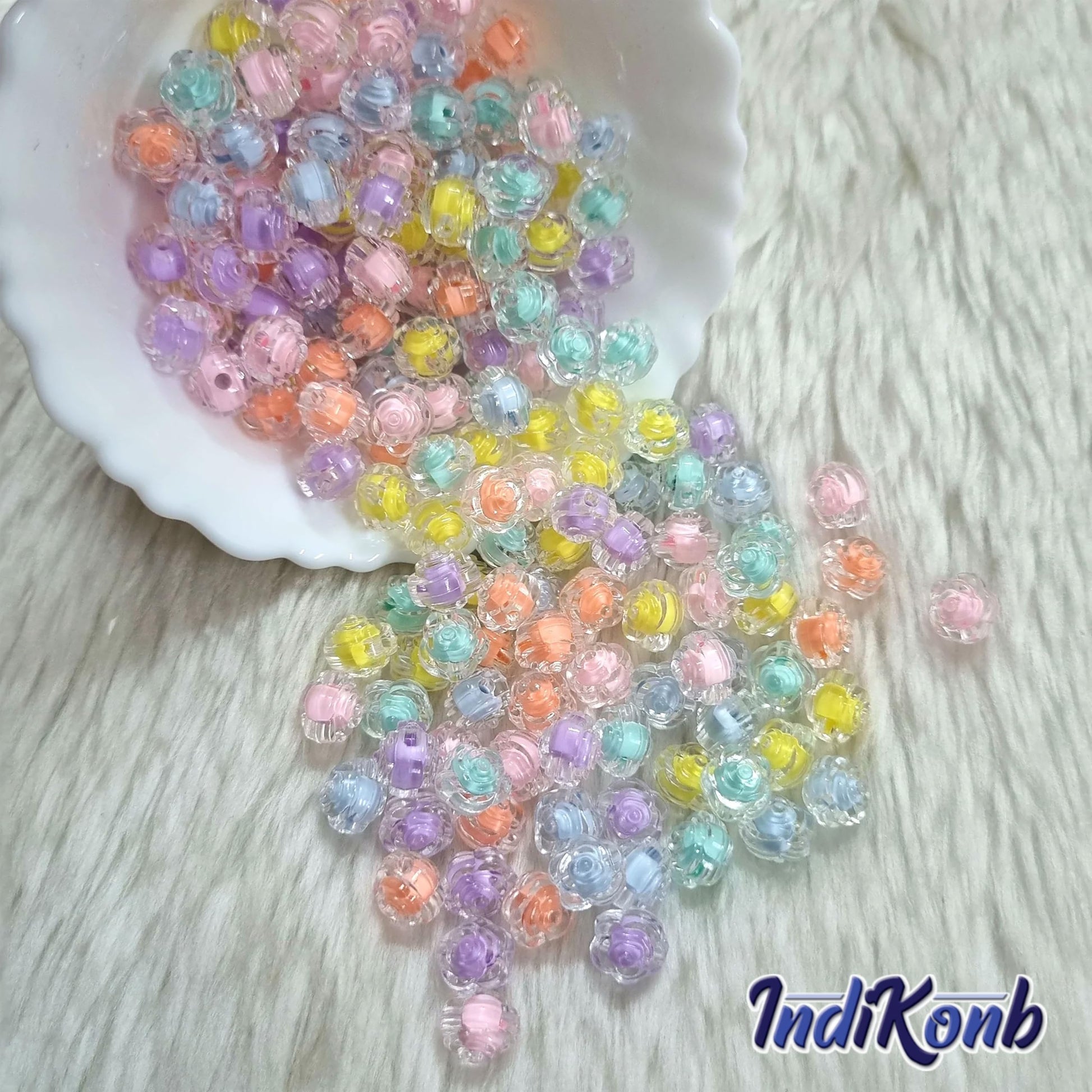 All beads and multicolour plastic and acrylic beads support beading craft with a clean decorative finish.