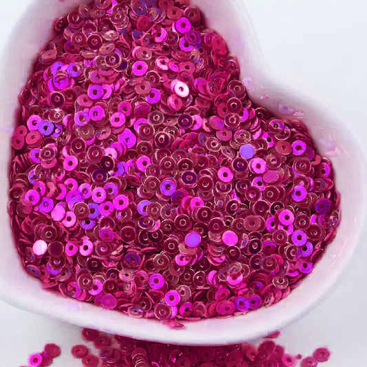 The sparkling look finish of dark magenta 4mm sequins round shape 4mm sitara sequins with holes works nicely in Embroidery for embroidery, craft decoration and fabric embellishment.