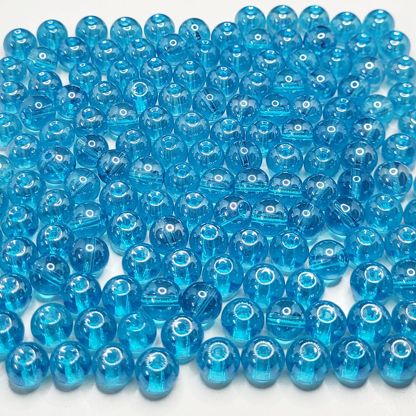 To add a clean decorative look, place sea blue and multicolour 8mm beads into bracelet making, necklace making and DIY jewellery projects.