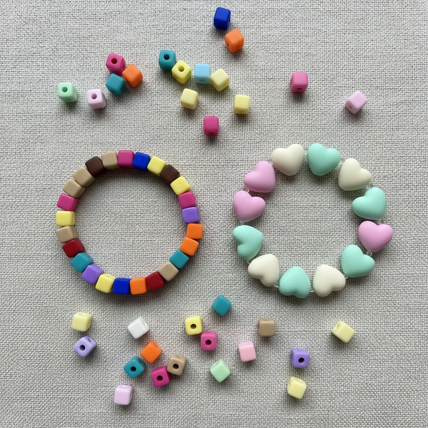 Turn simple phones into handmade accessories with multicolor bead loops and charm-making parts.