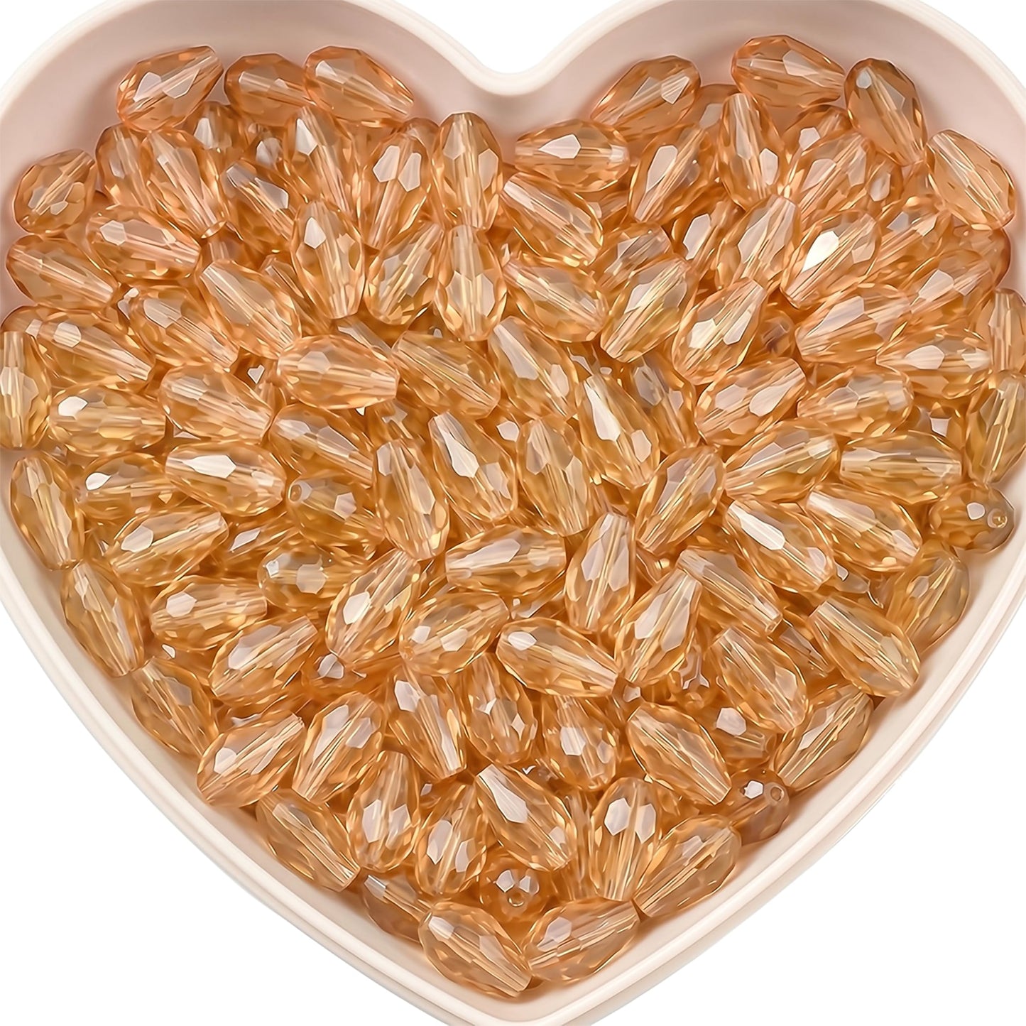 Add graceful dangle accents to earrings and charms with 15x10mm peach faceted teardrop beads.