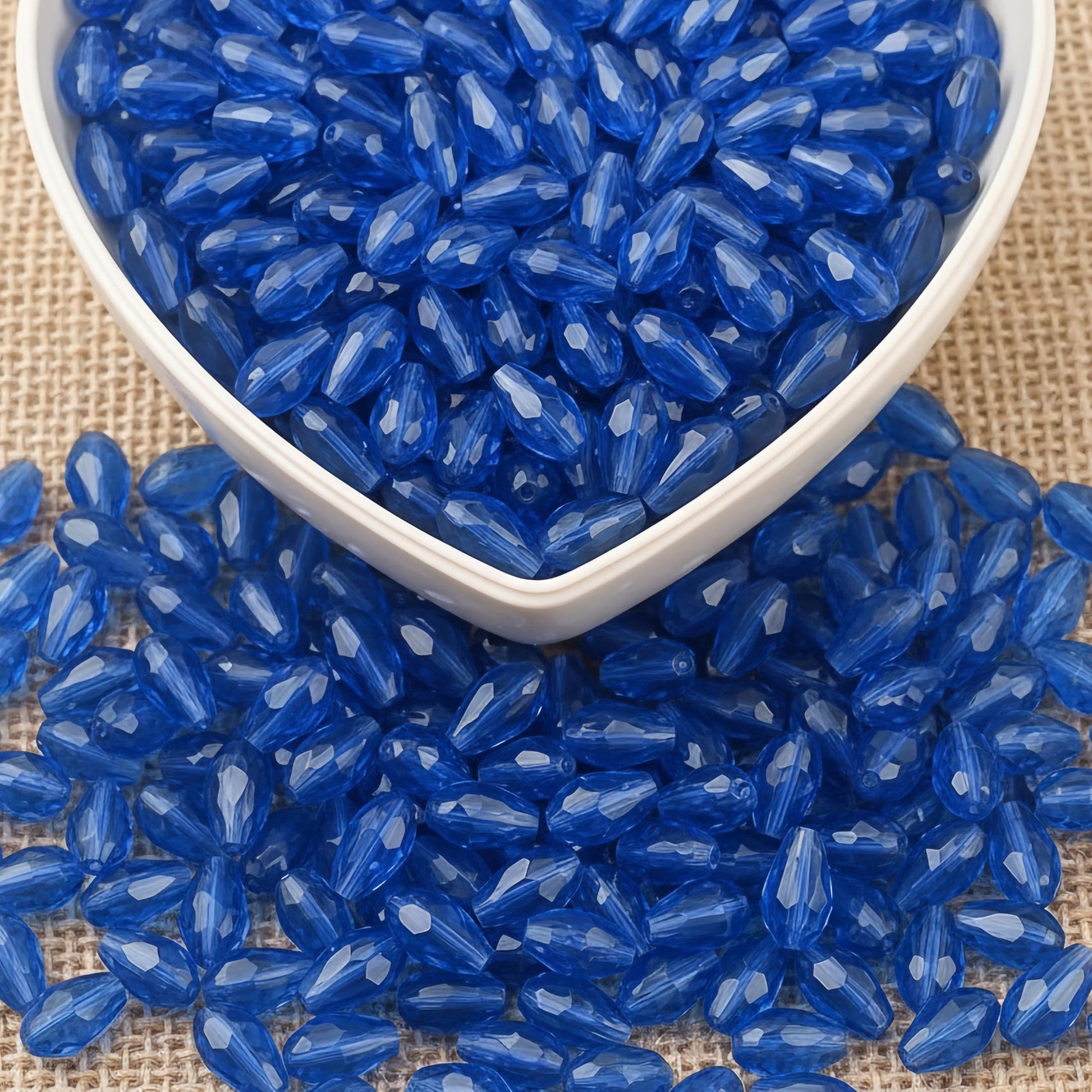 Design delicate charms, anklets and earrings with 10x6mm blue cut-facet teardrop beads.
