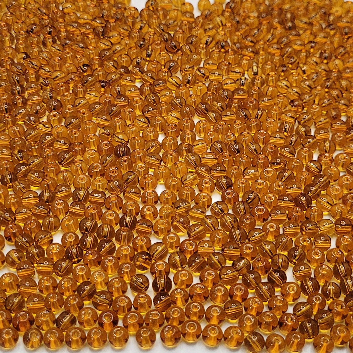 Bracelet making, necklace making and DIY jewellery projects benefits from gold and multicolour 4mm beads and clean decorative look.