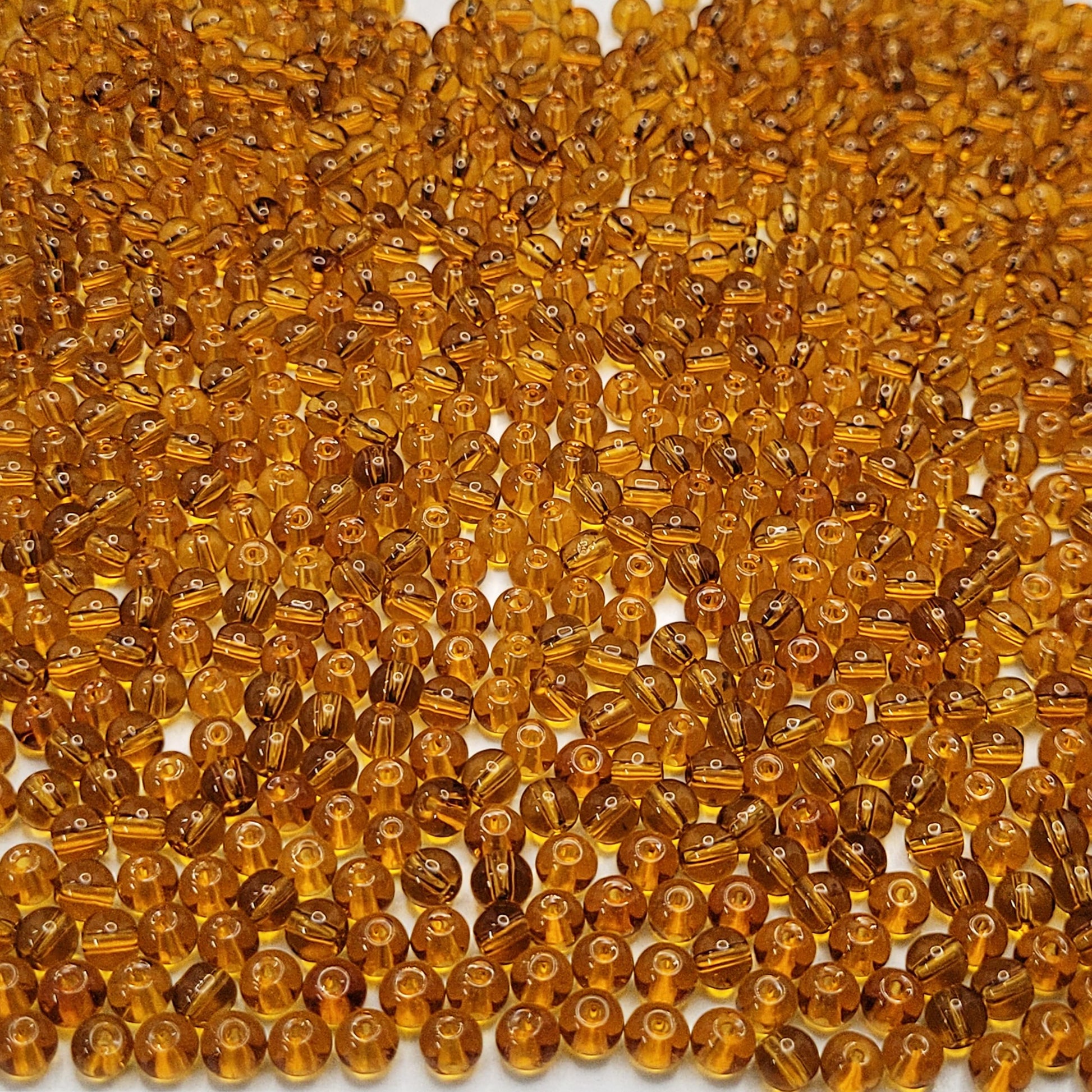 Bracelet making, necklace making and DIY jewellery projects benefits from gold and multicolour 4mm beads and clean decorative look.