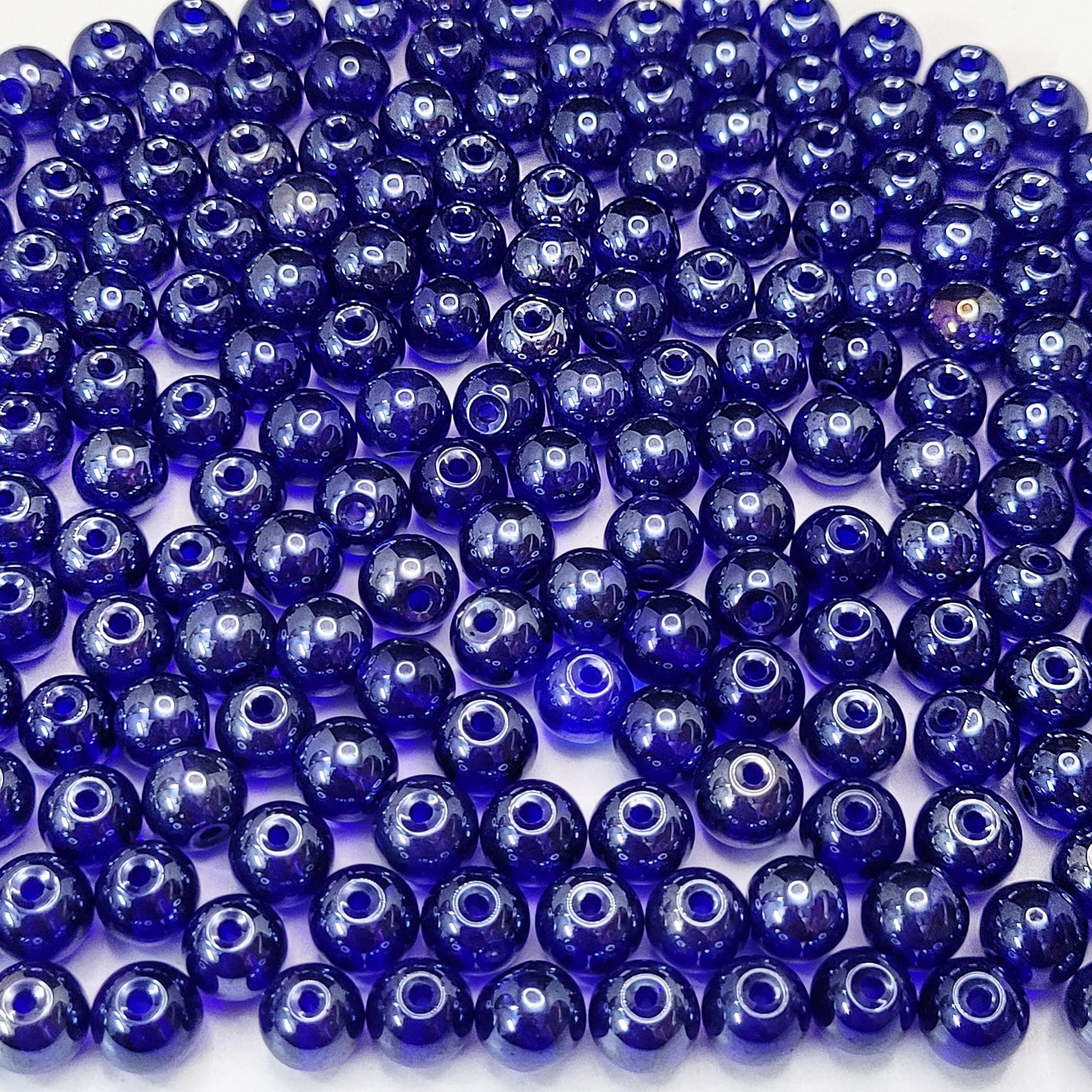 Add a clean decorative look into bracelet making, necklace making and DIY jewellery projects with blue and multicolour 8mm beads.