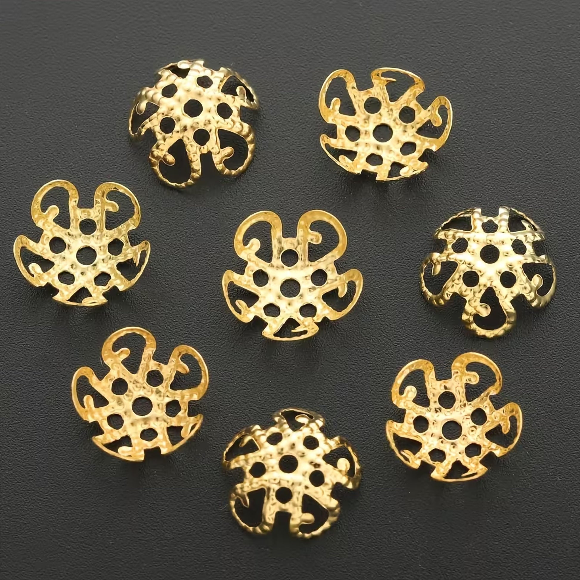 Add traditional jewelry finish to latkan work and bead jewelry with ornate gold petal bead caps.