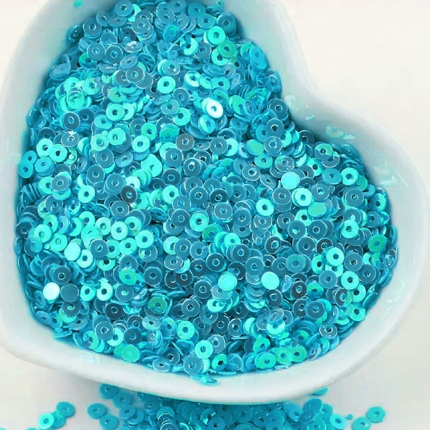 Sky blue 4mm sequins round shape 4mm sitara sequins with holes give Embroidery for embroidery, craft decoration and fabric embellishment a neat visual lift.