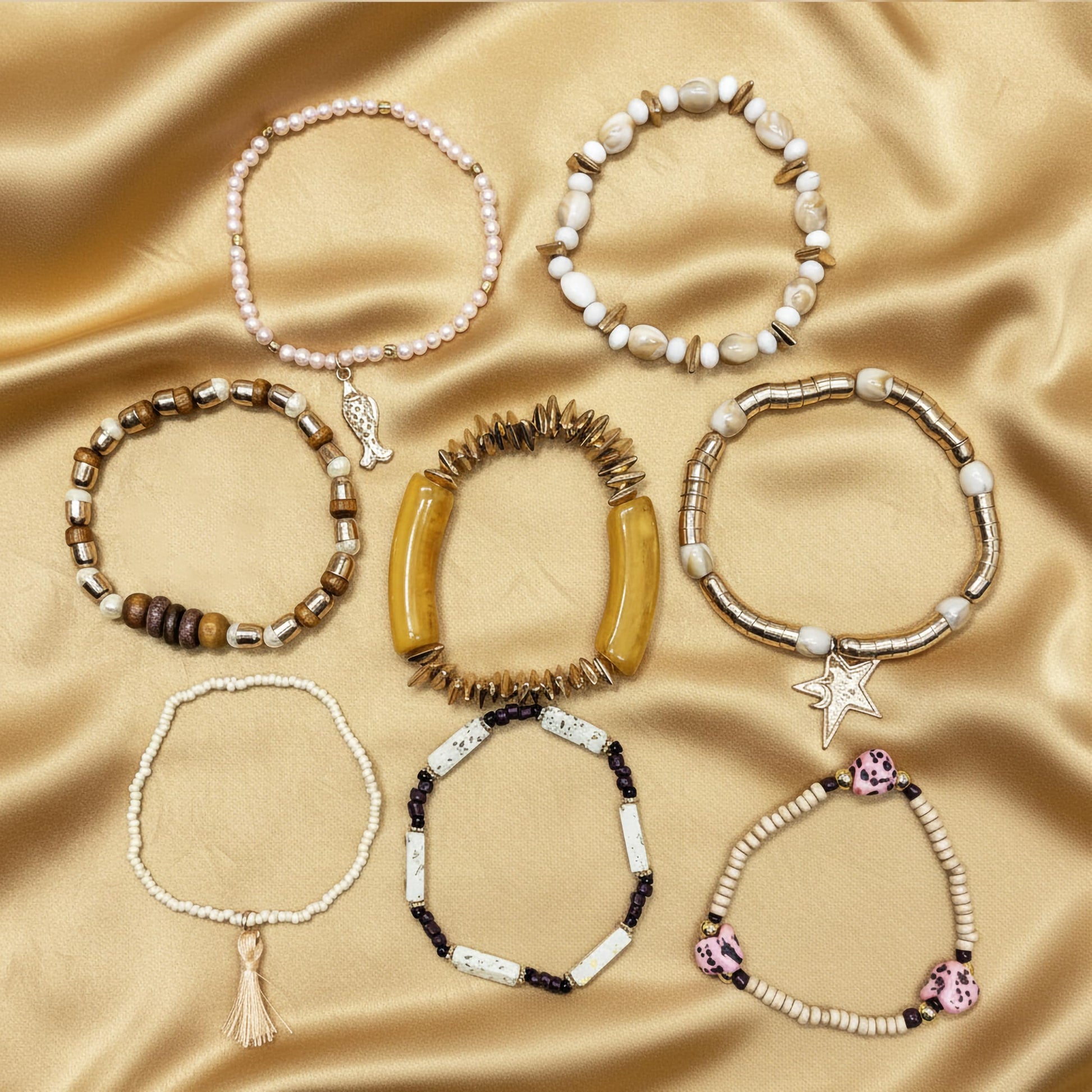 Gift an easy coastal accessory with a white beaded shell bracelet set for women.