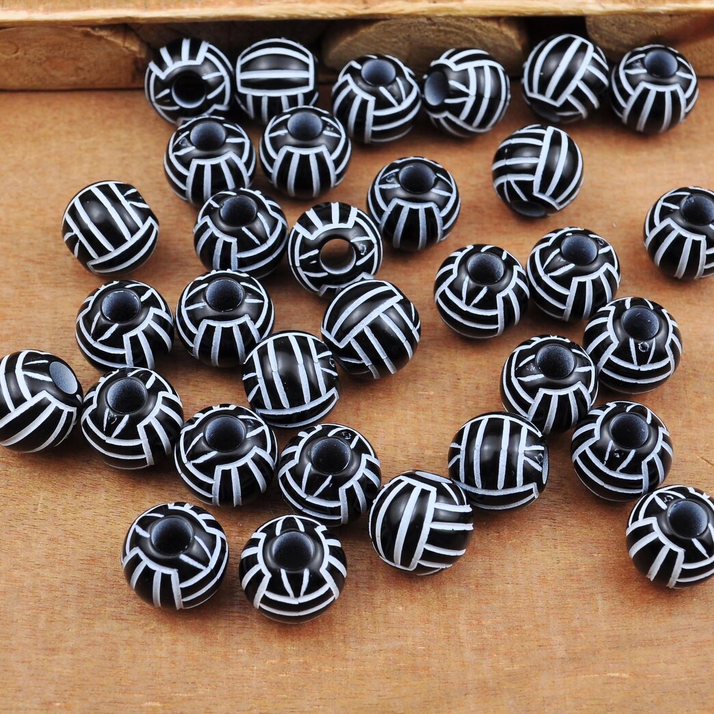 Jewelry making beads with black white volleyball design