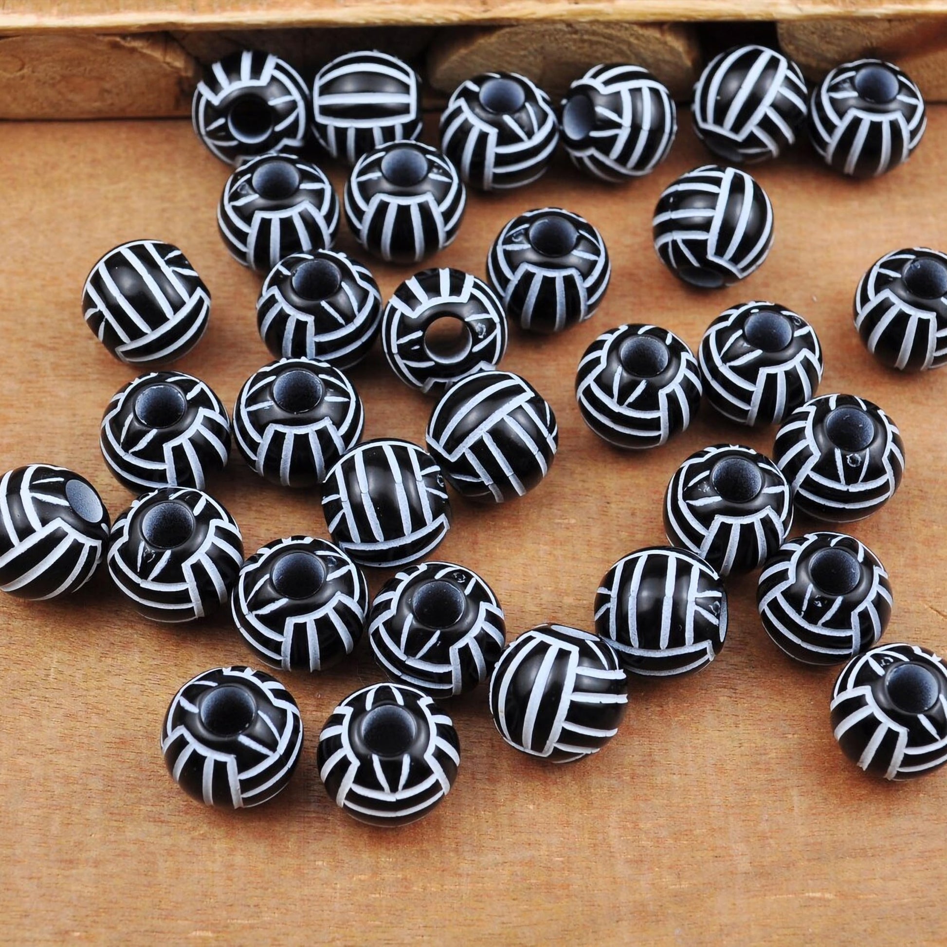 Jewelry making beads with black white volleyball design