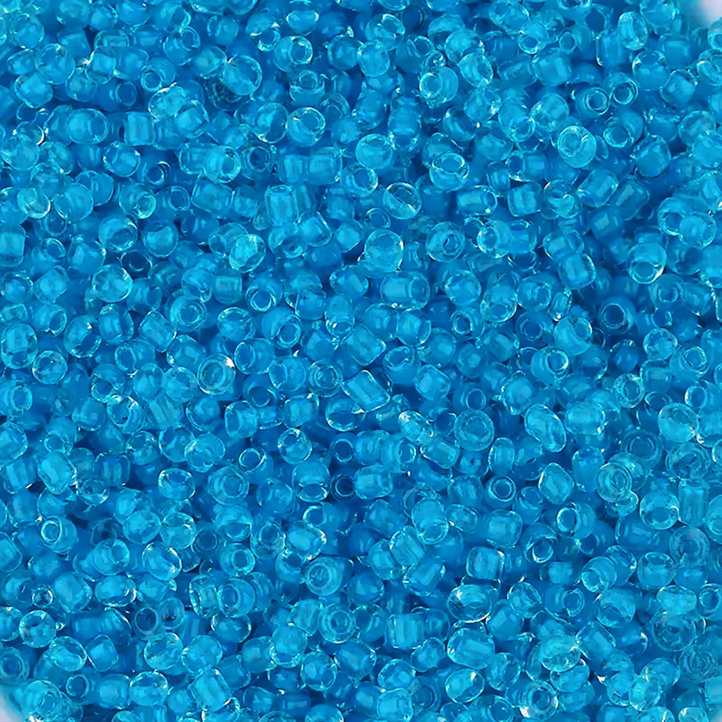 Sky Blue Seed Beads Transparent Finish Small Glass Beads Size 110-2mm. Main product image showing the full assortment for jewelry making and craft work.