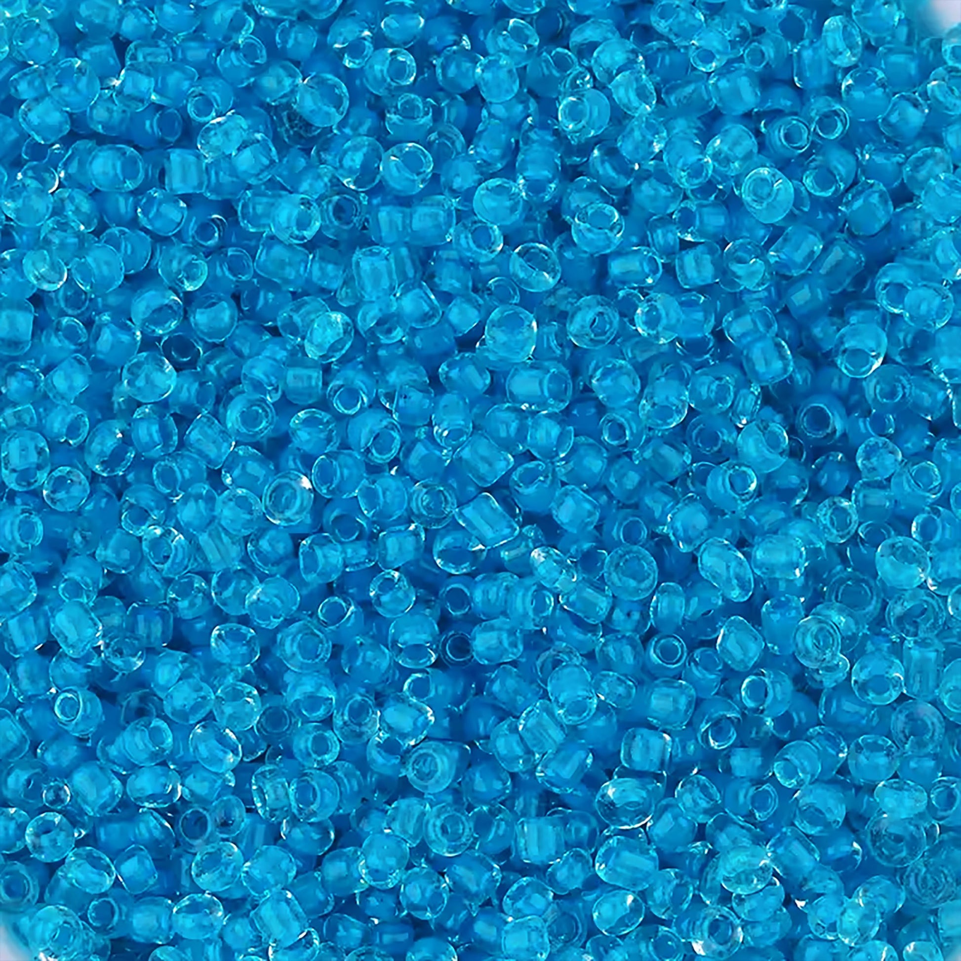 Sky Blue Seed Beads Transparent Finish Small Glass Beads Size 110-2mm. Main product image showing the full assortment for jewelry making and craft work.