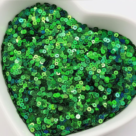The sparkling look finish of dark green 4mm sequins round shape 4mm sitara sequins with holes works nicely in Embroidery for embroidery, craft decoration and fabric embellishment.